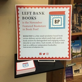 A sign at Left Bank Books that announces the store as Book Post's featured store for November.