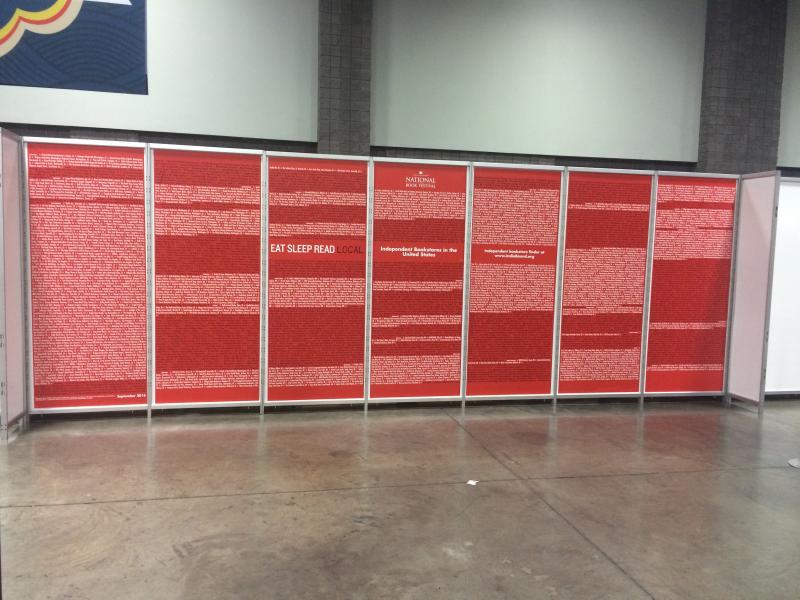 All seven wall paper panels featuring the names of ABA member stores, organized by state.