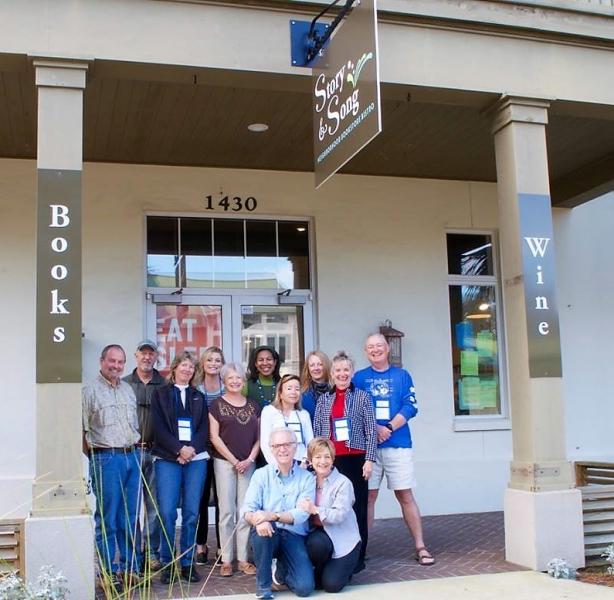 Mark and Donna Paz Kaufman, in front, are excited about their new bookstore.
