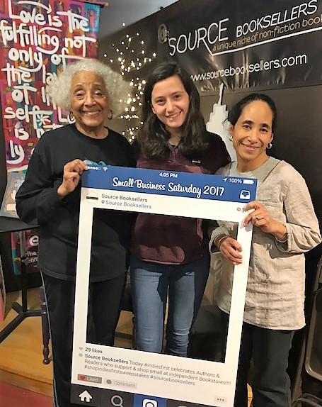 Sweepstakes winner Marissa Wais, center, enjoys congratulations from Source Booksellers owner Janet W. Jones, left, and bookseller Alyson Jones Turner, right. 