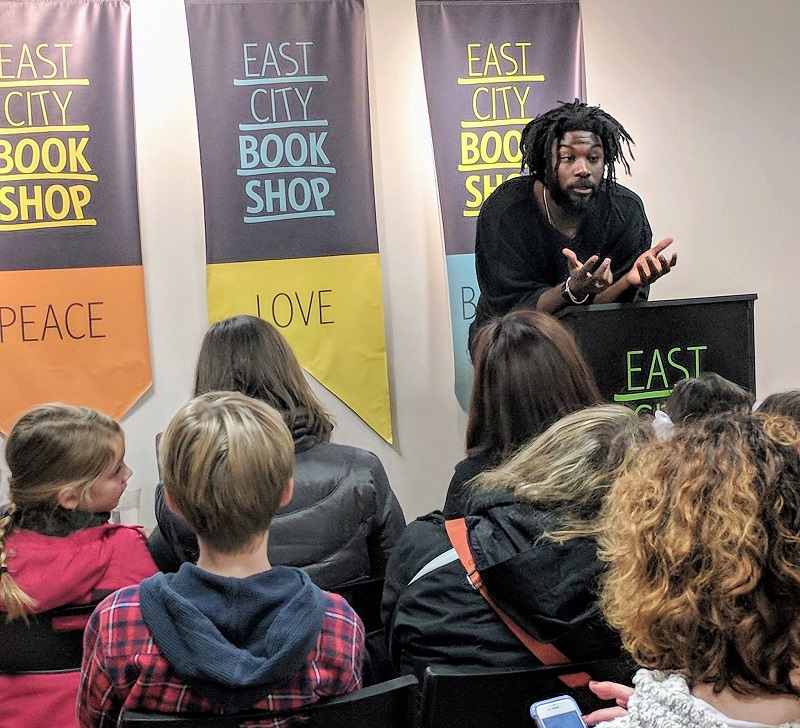 Jason Reynolds speaks with fans at East City Bookshop.