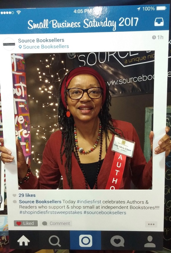 Author Jean Alicia Elster tries out the selfie station at Source Booksellers.
