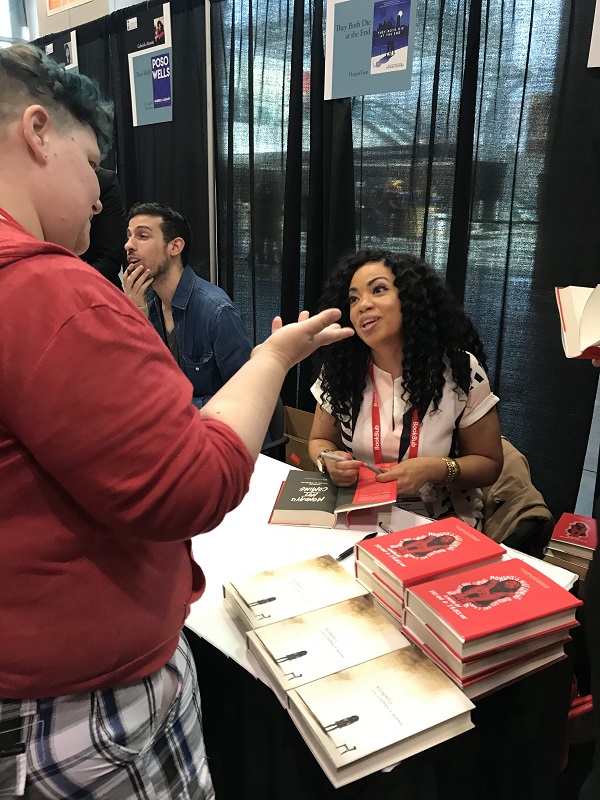 Tiffany Jackson chats with an indie bookseller after the lunch.