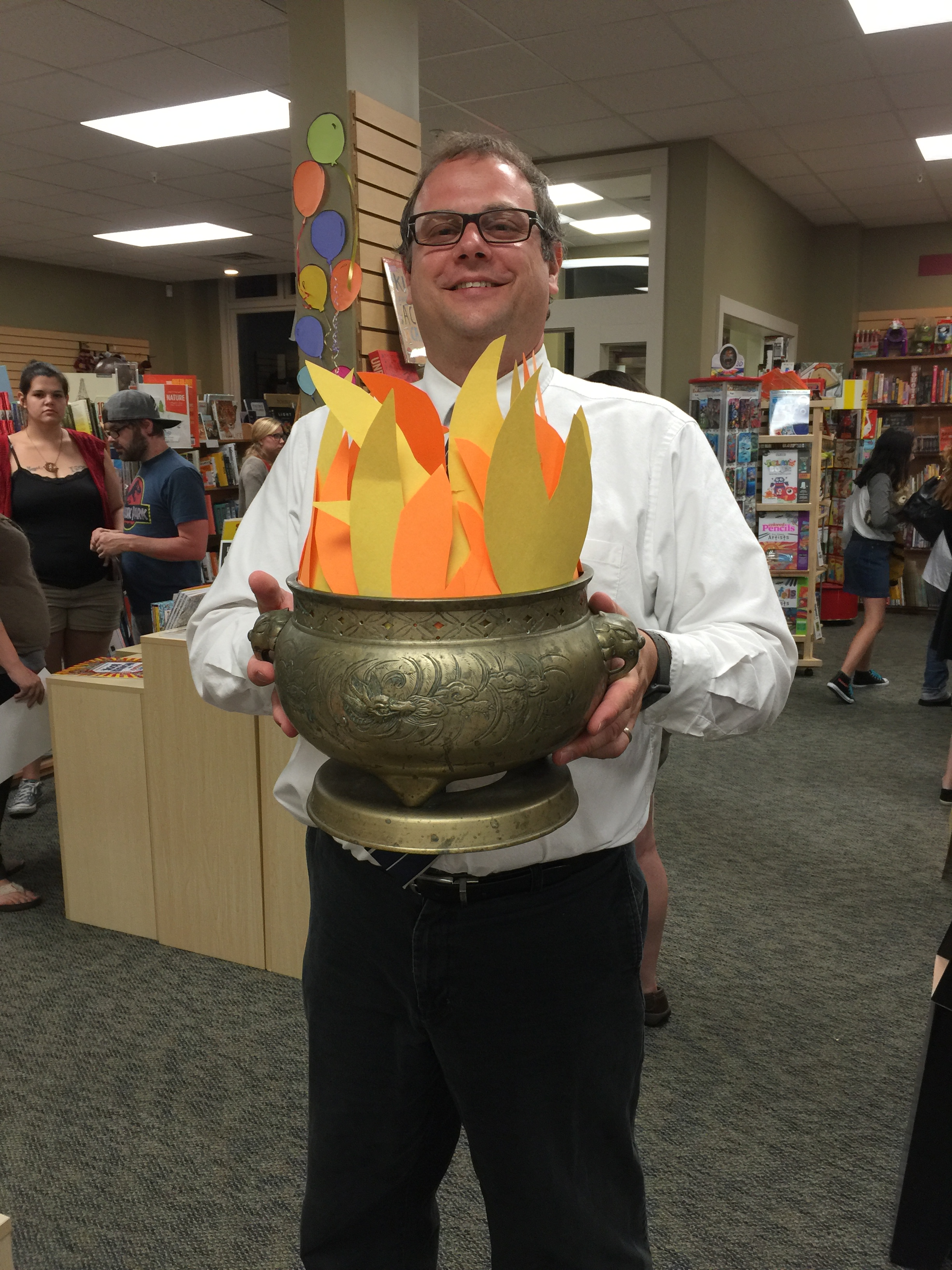 Bookseller Will Notte holds up the Goblet of Fire at Phoenix Rutland.