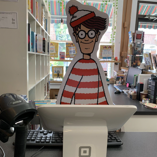 Waldo behind the counter at The Book Worm Bookshop