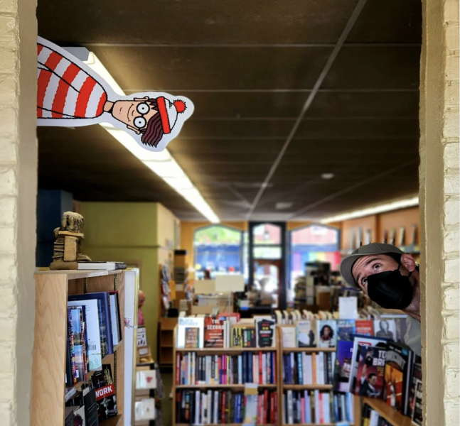 Waldo cutout peeking out behind a wall at Water Street Bookstore