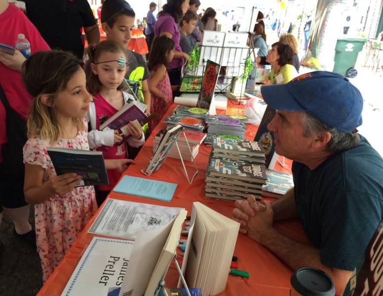 Young readers meet with author James Preller at the Warwick Children's Book Festival.