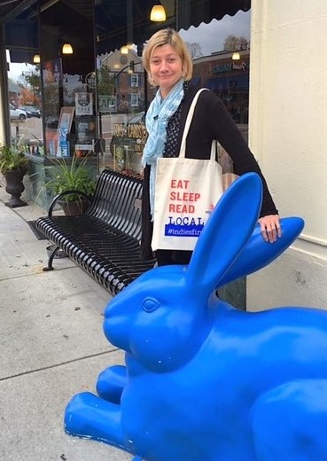 Margie Leonard at The Blue Bunny with an Indies First bag.