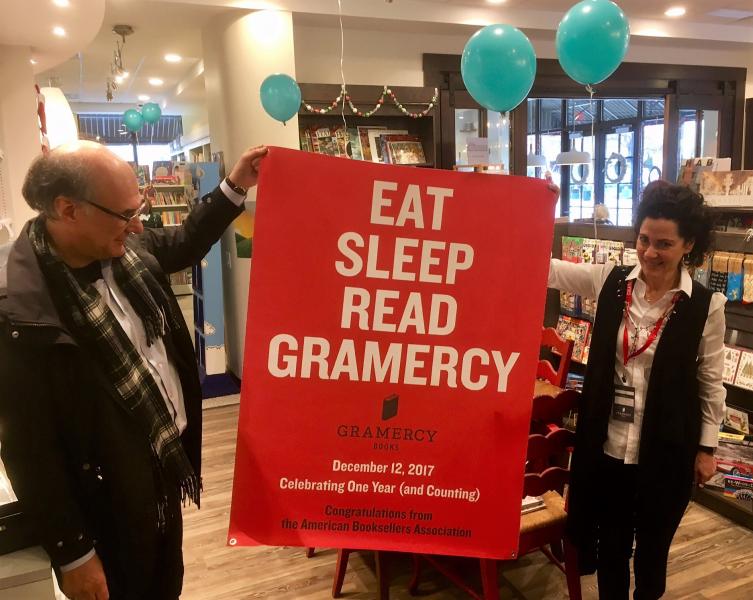 ABA CEO Oren Teicher presents owner Linda Kass with a poster to celebrate Gramercy Books’ first anniversary.