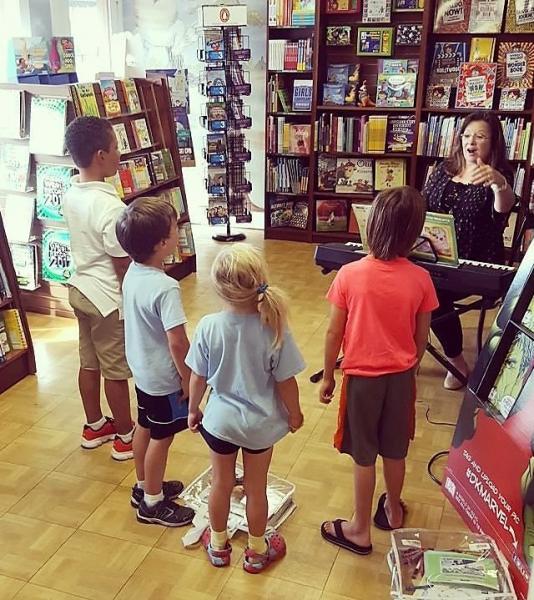 John Cavalier opened the bookstore to community groups, like this Little Mozart class, after the flooding affected 90 percent of his town.
