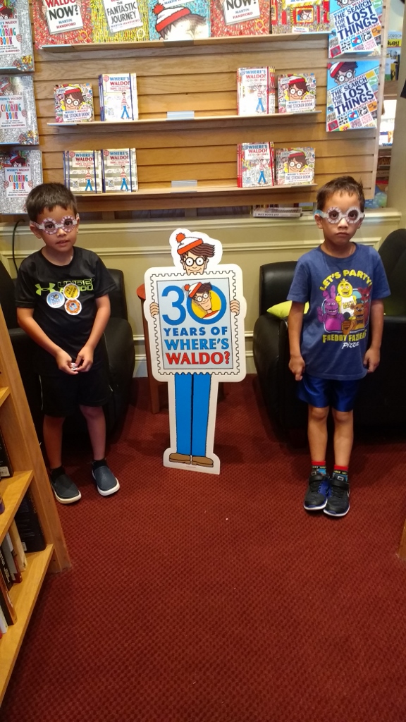 Kids pose with Waldo at Novel Books in Clarksburg, Maryland.